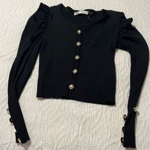 Black ribbed fitted sweater with gold buttons